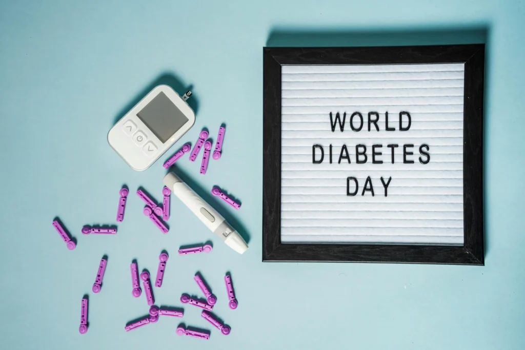 pexels-photo-6303708-6303708 Top view of lancets for blood glucose meter placed near glucometer and letter board with World Diabetes Day inscription